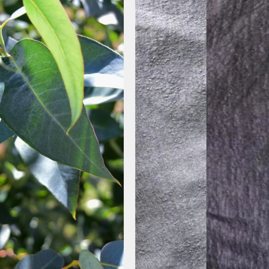 Eucalyptus leaves next to silver and charcoal alpaca wool fabrics