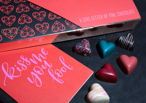 Love letter chocolate box with hearts on black background 