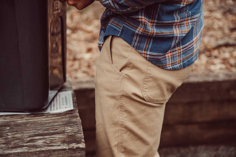 Man wearing Mountain Pant and standing outside