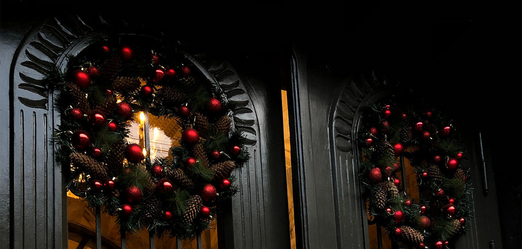 2 wreaths in black front door