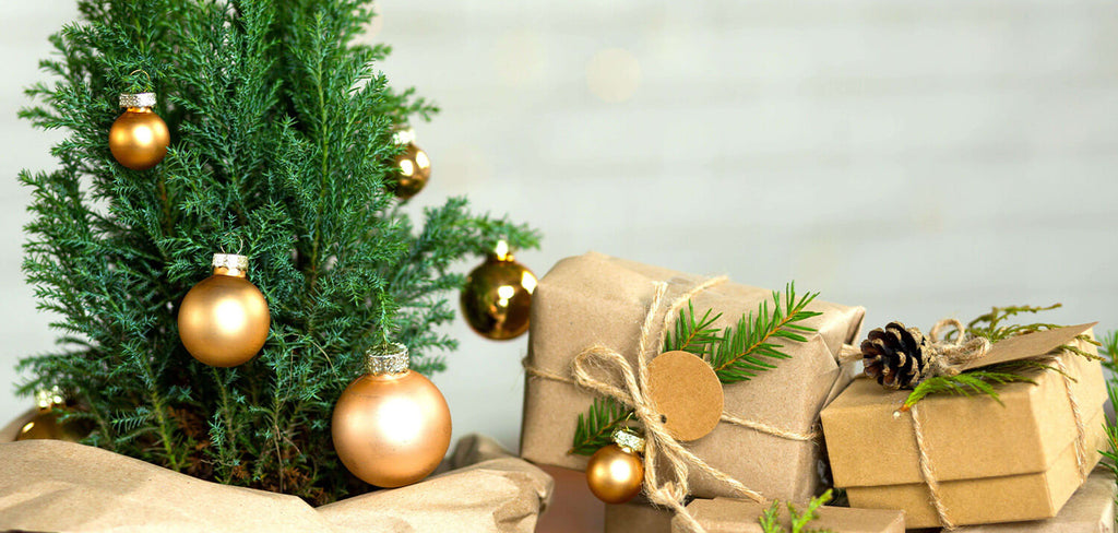 Small Christmas Tree with golden decor and gifts