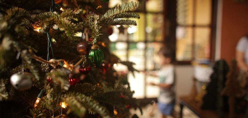 xmas tree with kid in background