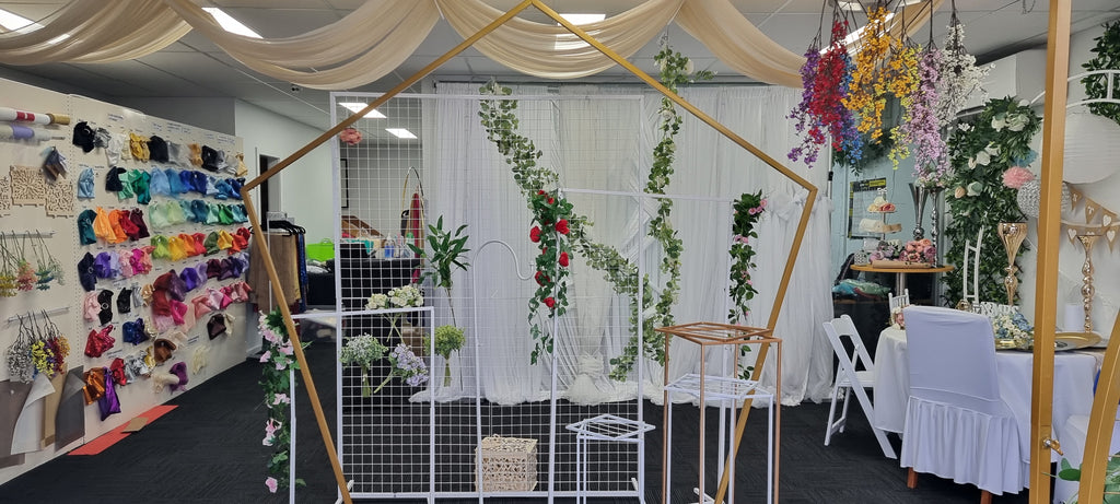 Showroom showing frame, chair bands and flowers