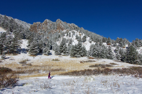 Woman running through the mountains