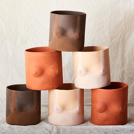 Six top nude planters in different skin colours, some with tanning lines on a linen backdrop