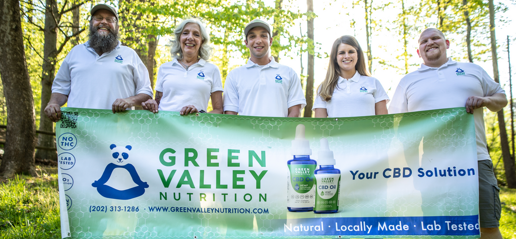 Green Valley Nutrition Team Holding Panda Banner Outside