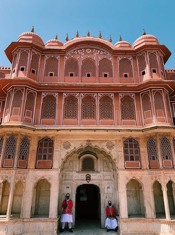 city palace in jaipur with two gaurds