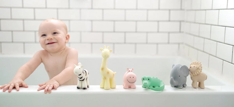 baby playing with bath toys