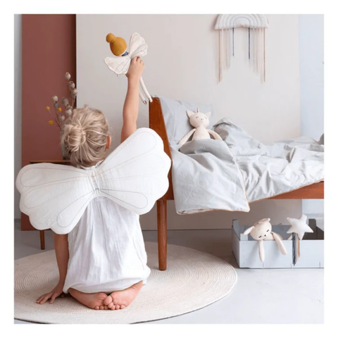 child playing as an angel