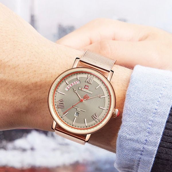 Man wearing  rose-gold Teveno Men's Stainless Steel Mesh Watch on wrist