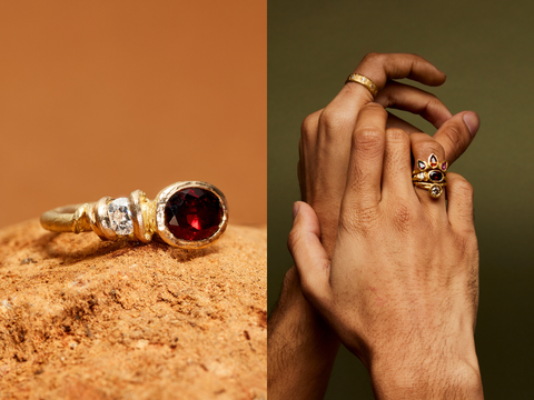 The Bramble ring sits on a rock. a deep red oval garnet bezel set alongside a diamond set in vines wrapped around it.