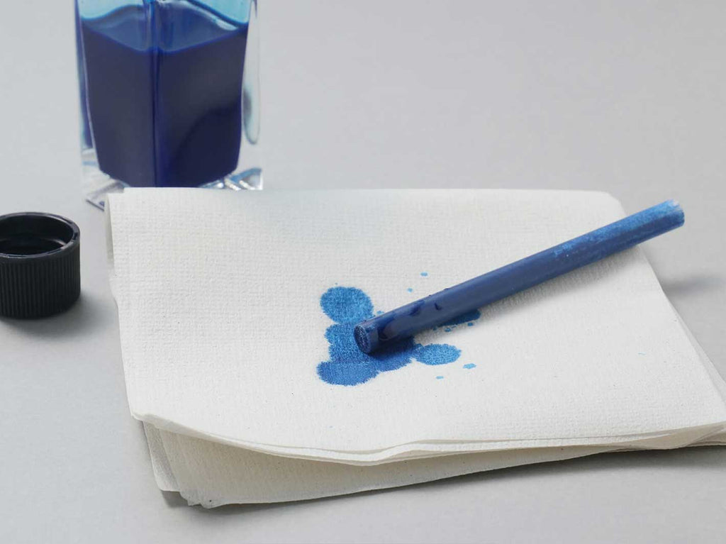 Wipe off excess ink around the plastic with a tissue or soft cloth.