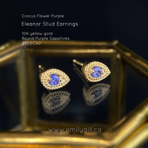 Pear shape stud earrings in 10 karat yellow gold featuring small round purple sapphires and miligrain hand engraved details