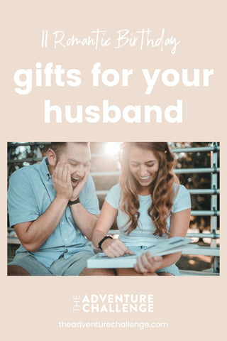 Wife surprising her husband with a birthday gift with the sun glaring behind them; image overlaid with text that reads 11 Romantic Birthday Gifts For Husband