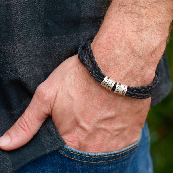 Close-up shot of guy putting his hands in his pocket and wearing a Personalized Family Names Bracelet