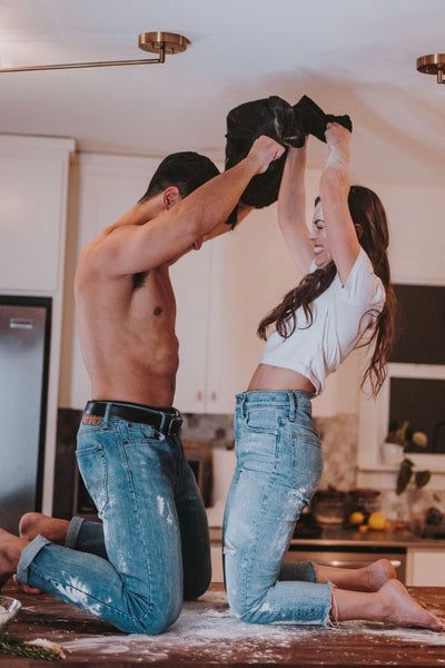 Couple undressing each other in the kitchen as they level up their foreplay