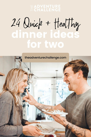 Couple sharing laughs with each other as they hold their dinner, with the guy about to place a finger on the girl's face; image overlaid with text that reads 24 Quick + Healthy Dinner Ideas for Two