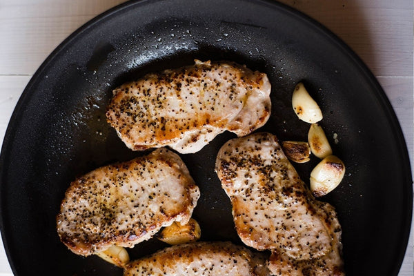 24 Quick and Healthy Dinner Ideas for Two: Garlic roasted pork chops.