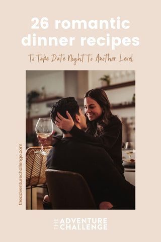Couple sharing an embrace during their dinner date, with the girl holding a wine glass; image overlaid with text that reads 26 Romantic Dinner Recipes to Take Date Night to Another Level