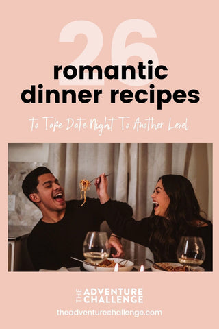 Couple laughing together as they feed each other spaghetti during their date night; image overlaid with text that reads 26 Romantic Dinner Recipes to Take Date Night to Another Level