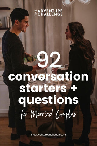 Couple smiling at each other as they set the table for their dinner date; image overlaid with text that reads 92 Conversation Starters + Questions for Married Couples