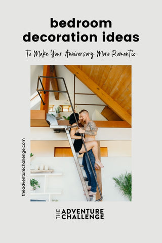 Couple posing and leaning in for a kiss on the stairs of their loft type apartment; image overlaid with text that reads Bedroom Decoration Ideas to Make Your Anniversary More Romantic