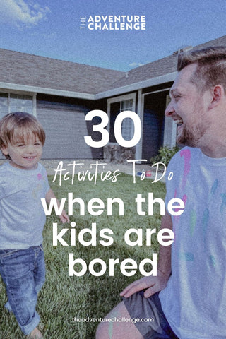 Dad playing with his son and smiling as they hang out at their backyard; image overlaid with text that reads 30 Activities To Do When the Kids Are Bored