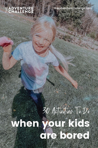 Little girl smiling at the camera as she runs around outdoors; image overlaid with text that reads 30 Activities to Do When the Kids Are Bored