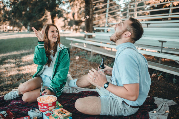 55 Cheap Date Ideas That Are Fun And Create Connection. Couple having fun at their picnic date.