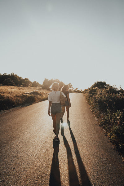 55 Cheap Date Ideas That Are Fun And Create Connection. Couple walking together on a nature trail.