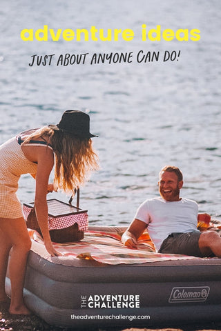 Couple hanging out by the lake with the guy lying on an inflatable mattress and the girl carrying a picnic basket; image overlaid with text that reads adventure ideas just about anyone can do!