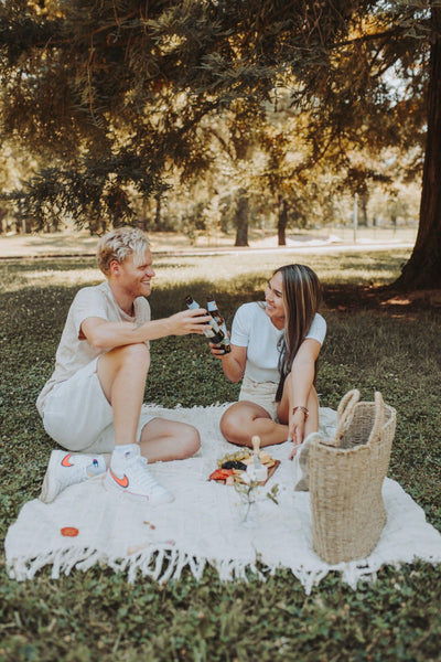 At Home Date Night Ideas: Couple having a fun time together at a picnic