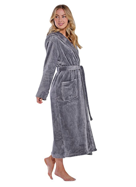 Woman smiles and poses with a gray plush hooded robe, a lovely birthday gift for your wife