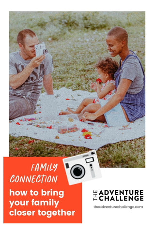Dad taking a polaroid photo of mom and baby while having an outdoor picnic; image overlaid with text that reads Family Connection How to Bring Your Family Closer Together
