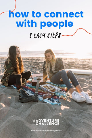 Two girl best friends laughing while enjoying a picnic at the beach with a guitar; image overlaid with text that reads how to connect with people 8 easy steps