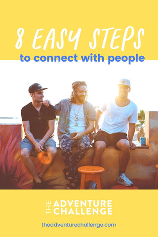 Three guy friends hanging out and perched up on a cement wall; image overlaid with text that reads 8 easy steps to connect with people