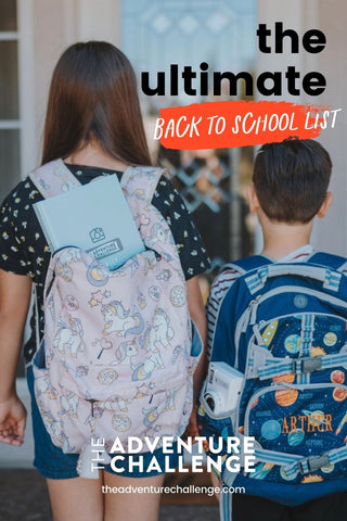 Little boy and girl with their backs to the camera wearing their backpacks as they head home from school; image overlaid with text that reads The Ultimate Back to School List