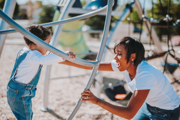  Why After School Activities Are so Important For Kids (And You!). Mother and daughter having a fun time at the playground.