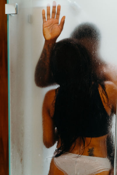 Why you should have a sexual bucket list: Couple inside steamy shower.