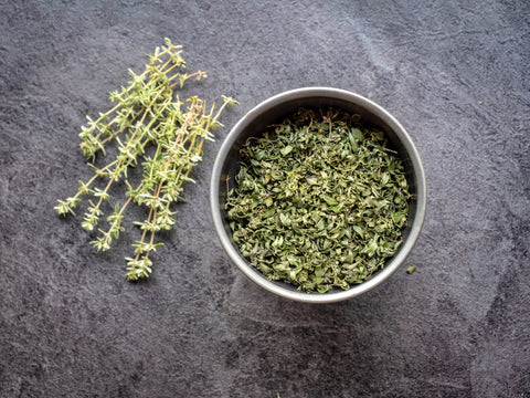 Thyme in bowl ground up