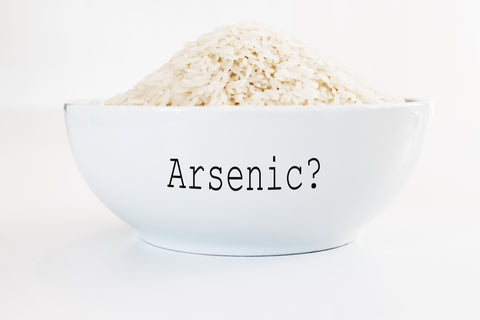 Inorganic Arsenic in rice - white bowl on white background