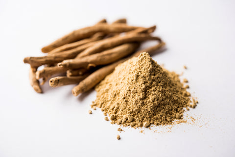 Ashwagandha root and powder on white