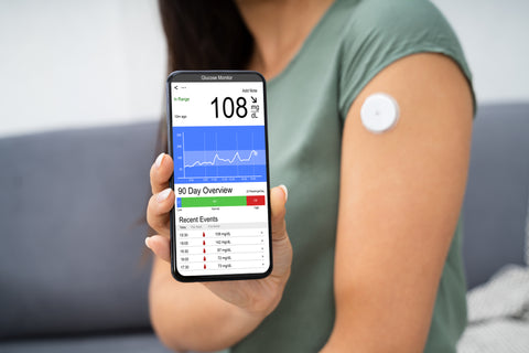 Woman getting her blood sugar levels tested