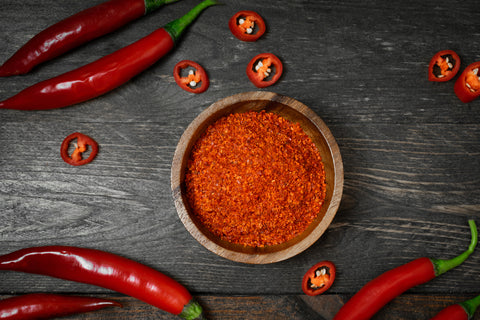 Cayenne Pepper in Bowl on Wood