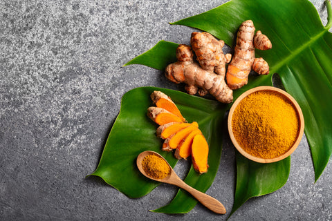 Turmeric Root and Powder on a Table