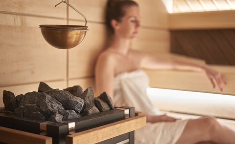 woman sitting in sauna