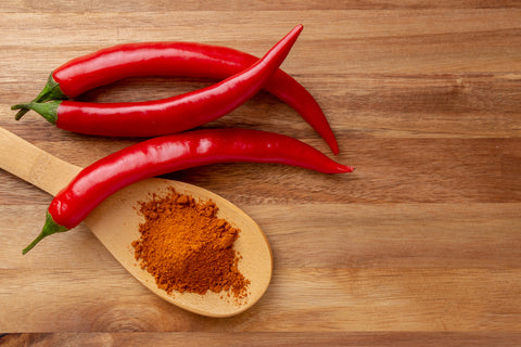 Cayenne Pepper on Wood Backdrop