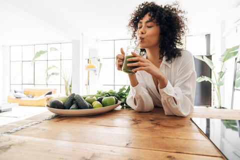 Woman drinking a healthy drink in the morning
