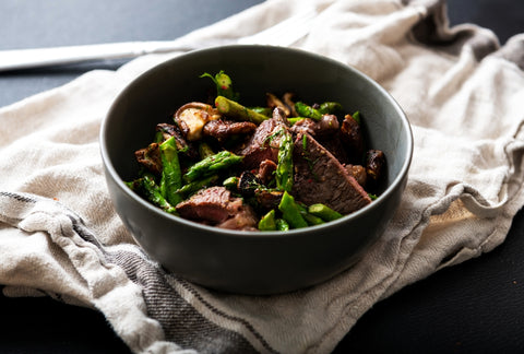 Grass-Fed Beef on Top of Vegetables in a Bowl