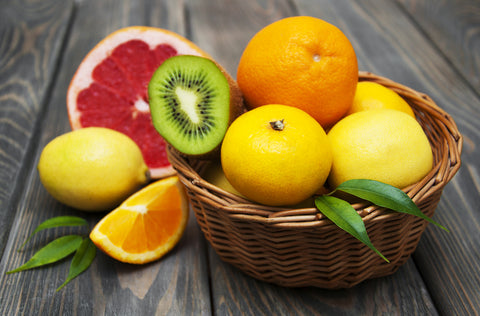 Citrus fruits in bowl on table